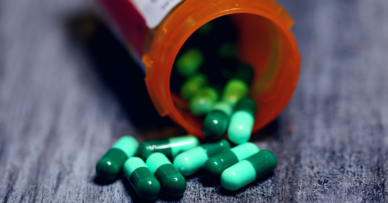 Pills spilling from a bottle