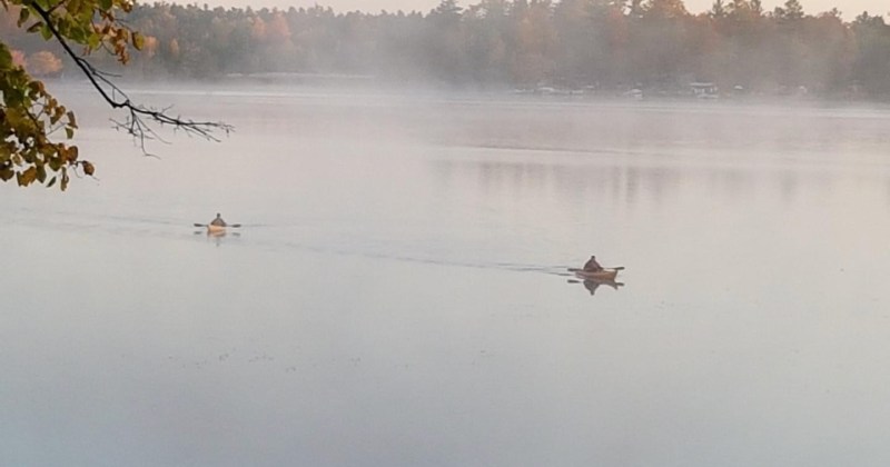 paddlers in the morning mist